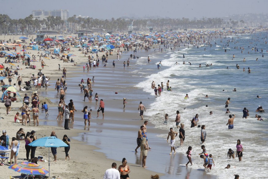 Visitors crowd the beach in Santa Monica, California on July 12, 2020, amid the coronavirus pandemic. (Image: AP)